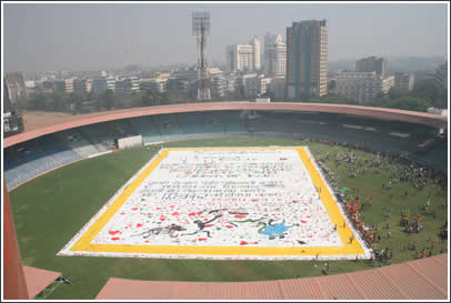 Kids approach the "World's Largest Love Letter" displayed in Wankhede Cricket Stadium, Bombay.