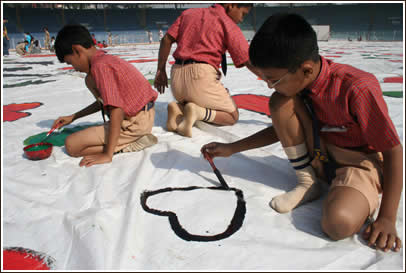School boys paint during the Wankheded Stadium event.