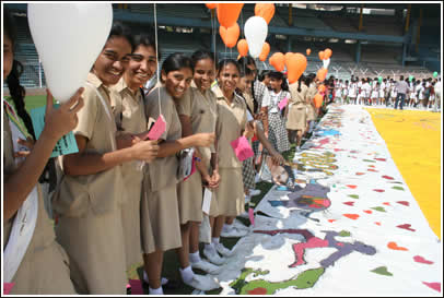 Students prepare for the balloon launch - sending messages of friendship up into the air with their names and school addresses on the backs. 